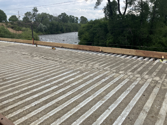 Concrete applied to steel decking