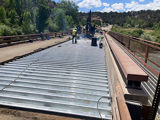 Crews have added nearly half the new decking to the north side of the County Road 108 (Thompson Creek Road) bridge near Carbondale.