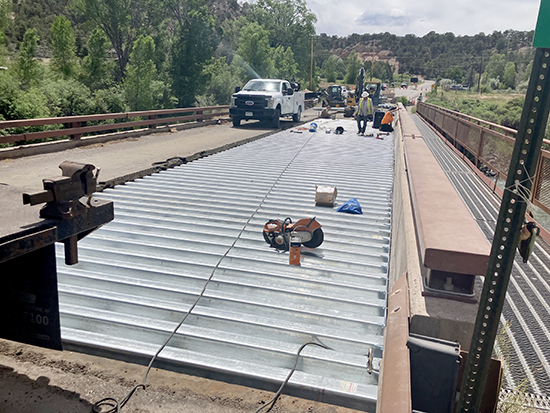 Crews have completed nearly three-quarters of the new steel decking on the north side of County Road 108  (thompson Creek Road) bridge near Carbondale.
