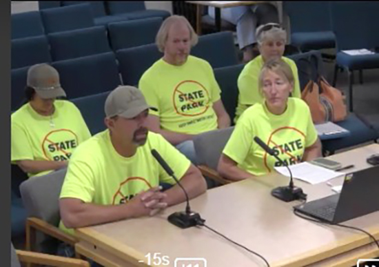 A group of residents from the Sweetwater Lake area speak to the Board of County Commissioners.