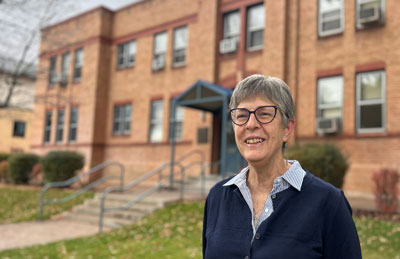 Kathy Lancaster standing in front of the Glenwood Springs Public Health building